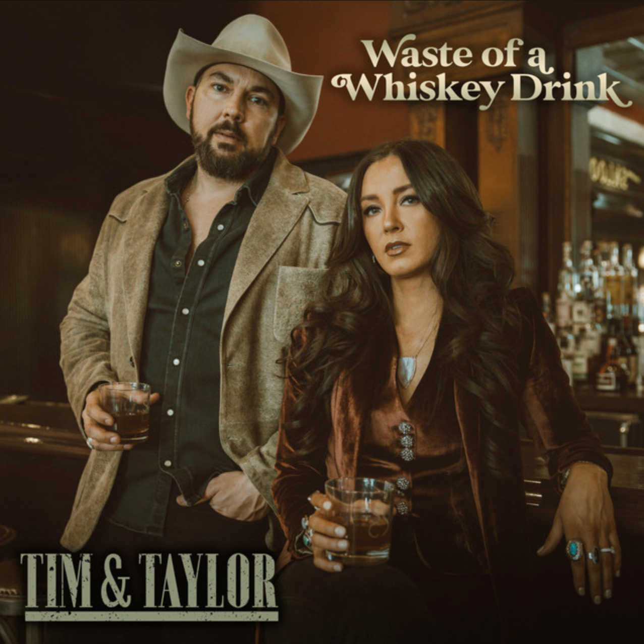 Tim & Taylor Waste of a Whiskey Drink single cover art, the duo holding whiskey glasses at a bar